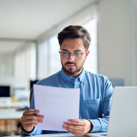 Man looking at a sheet of paper