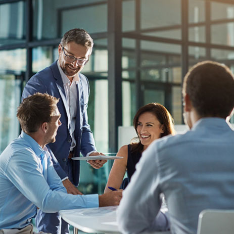 Employees talking at a table