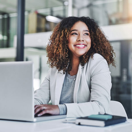 Woman sitting at a laptop